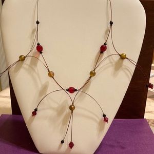 Umtha Hand beaded ruby red/black bead/burnt umber wired necklace